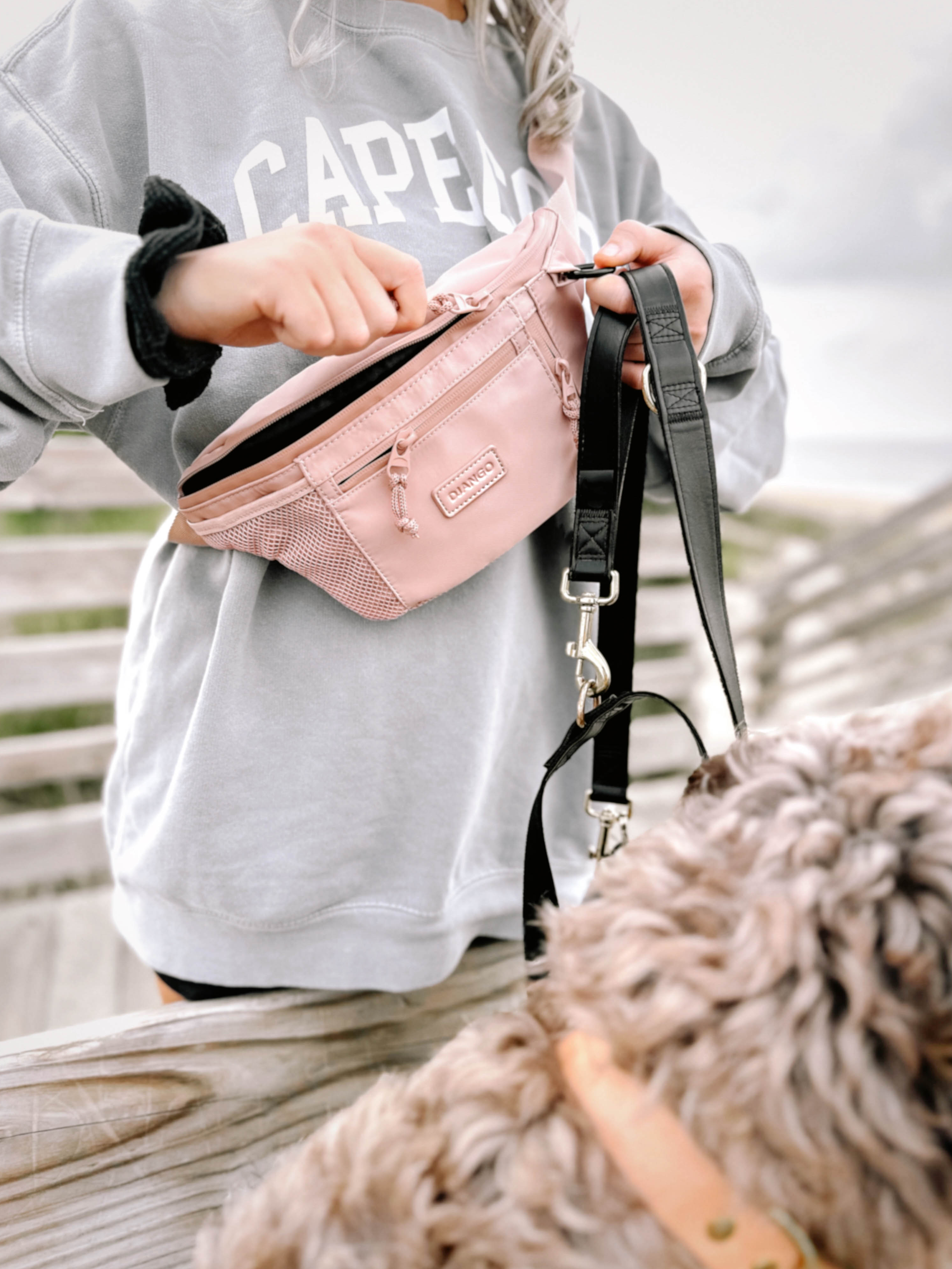 DJANGO's Nolita Belt Bag is a modern and ultra-functional essential for dog lovers, travelers, and explorers. The sleek and stylish fanny pack features a water-resistant exterior, spacious main compartment, and multiple interior and exterior zipper pockets for safe stashing. - djangobrand.com