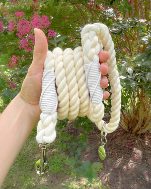 DJANGO Ivory Cotton Rope Dog Leash - You and your dog will be the most stylish ones on the sidewalk with this handcrafted and hand-dyed green ombré cotton rope leash. Crafted from soft and flexible three-strand natural cotton rope, the rope leashes are hand-spliced and the ends whipped, resulting in an incredibly strong yet effortlessly chic and comfortable dog lead. Silver hardware adds additional sophistication to the stylish dog lead. Leash length measures 5 feet (152 cm) - djangobrand.com