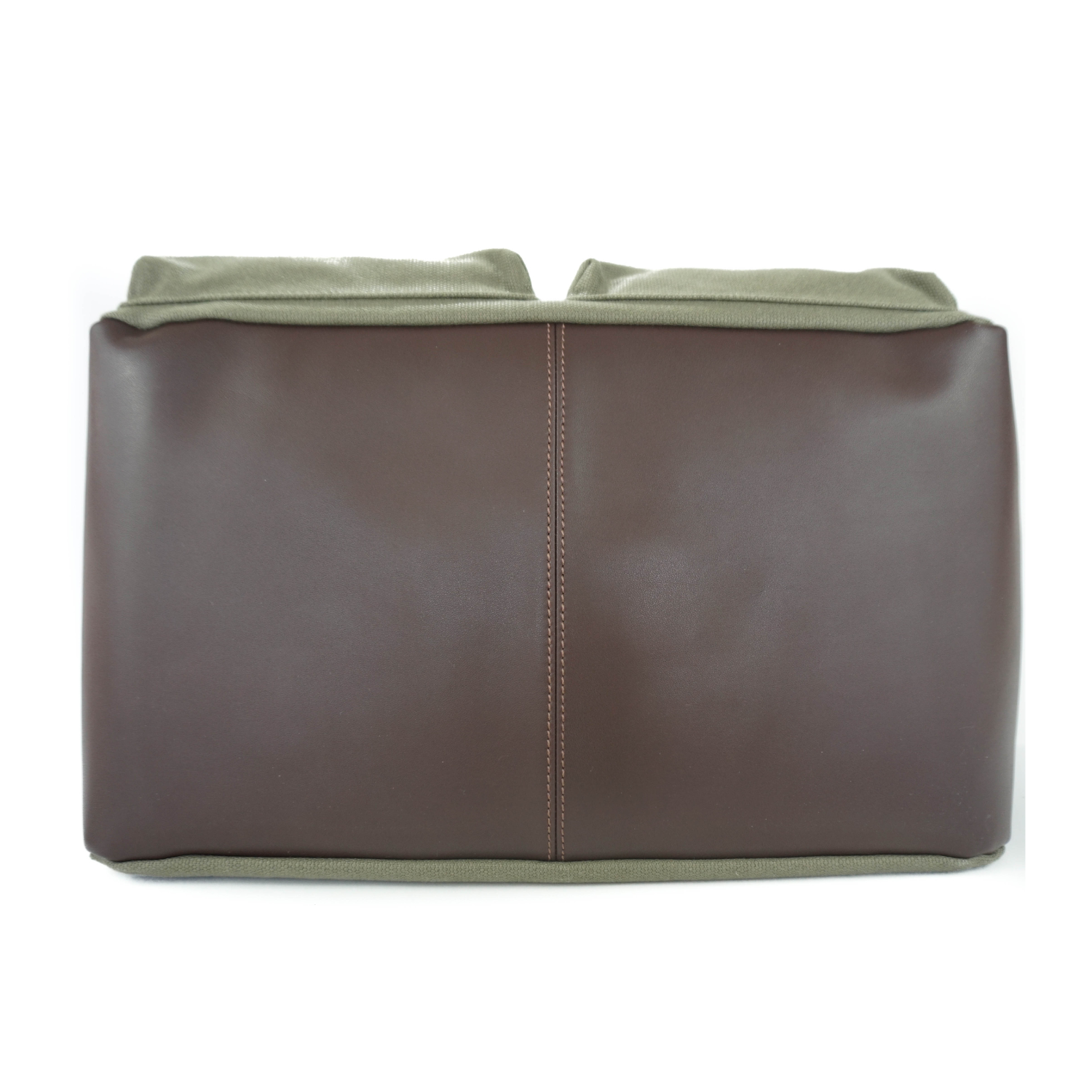 Brown leather base of dog carrier purse with olive green waxed canvas body on a white background