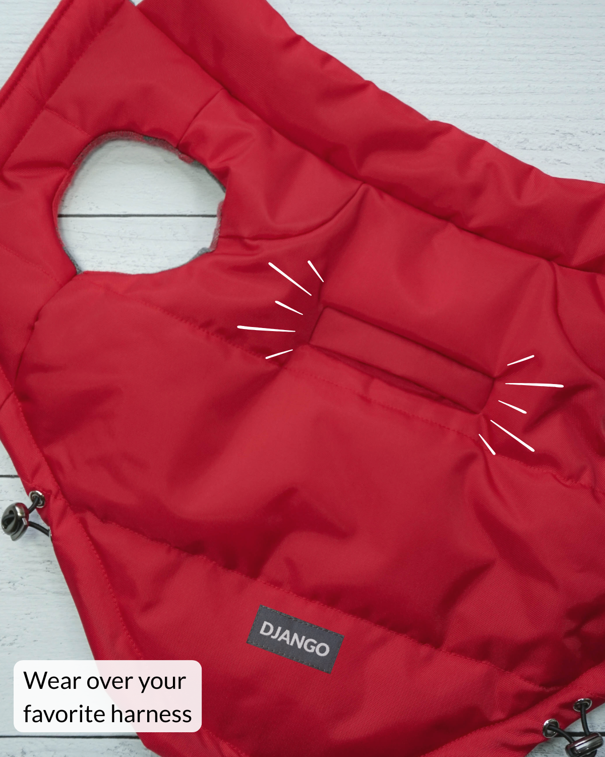 Red puffer dog vest with highlight of harness hole for easy leash attachment and DJANGO logo