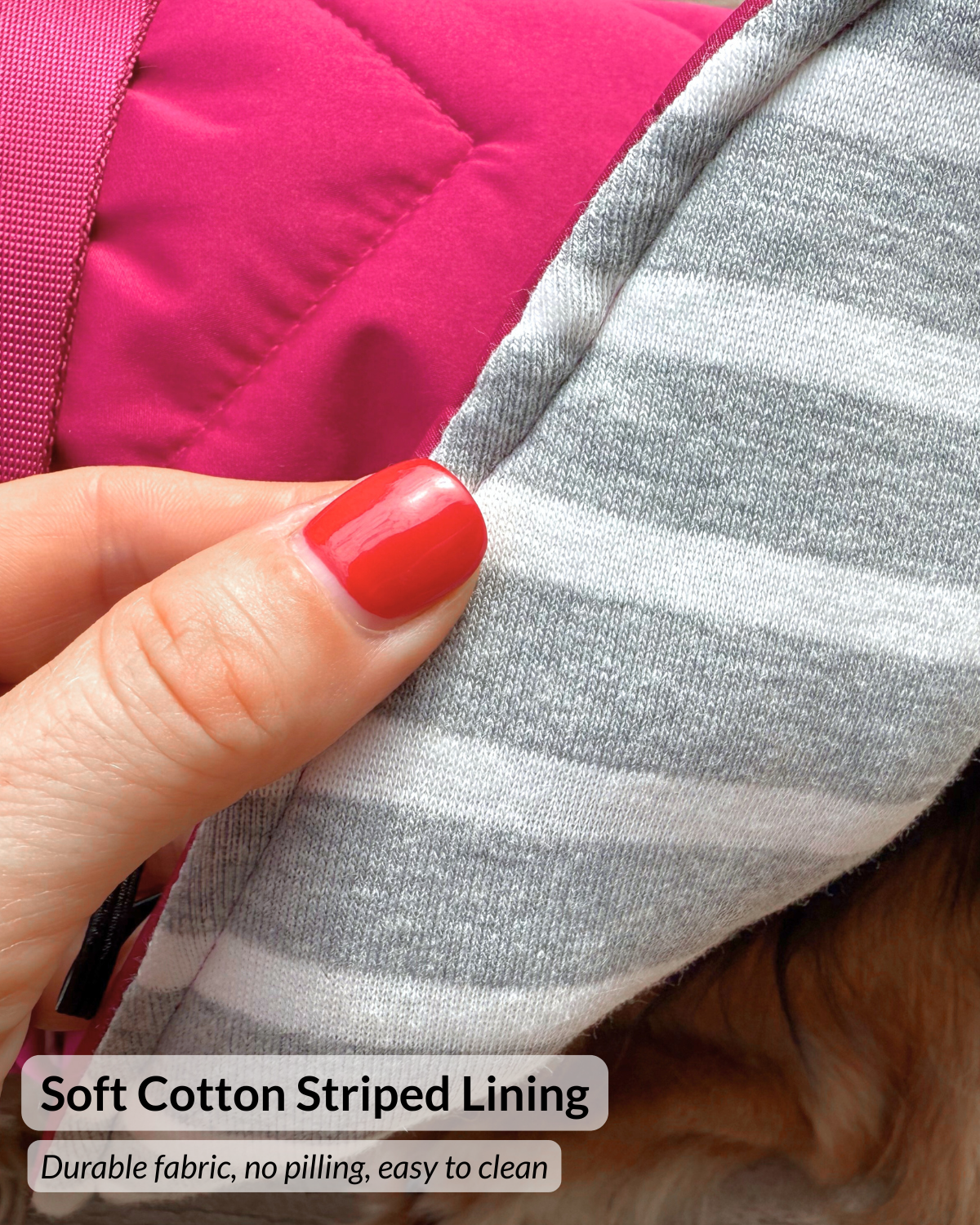 Close-up of a hand holding the edge of a pet garment to show the soft gray and white striped lining, with bright pink quilted fabric visible behind it. Text at the bottom reads 'Soft Cotton Striped Lining' and 'Durable fabric, no pilling, easy to clean.