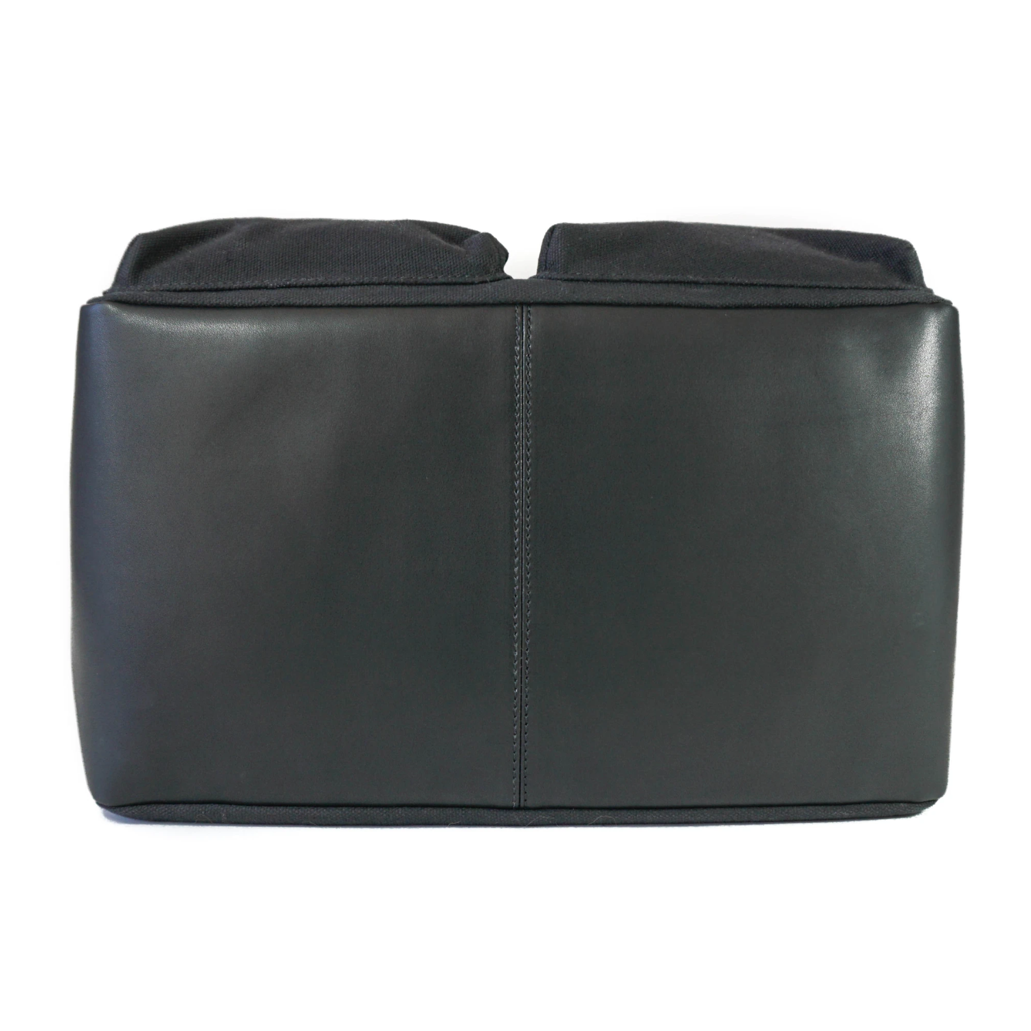 Black leather base of DJANGO dog carrier tote bag on white background