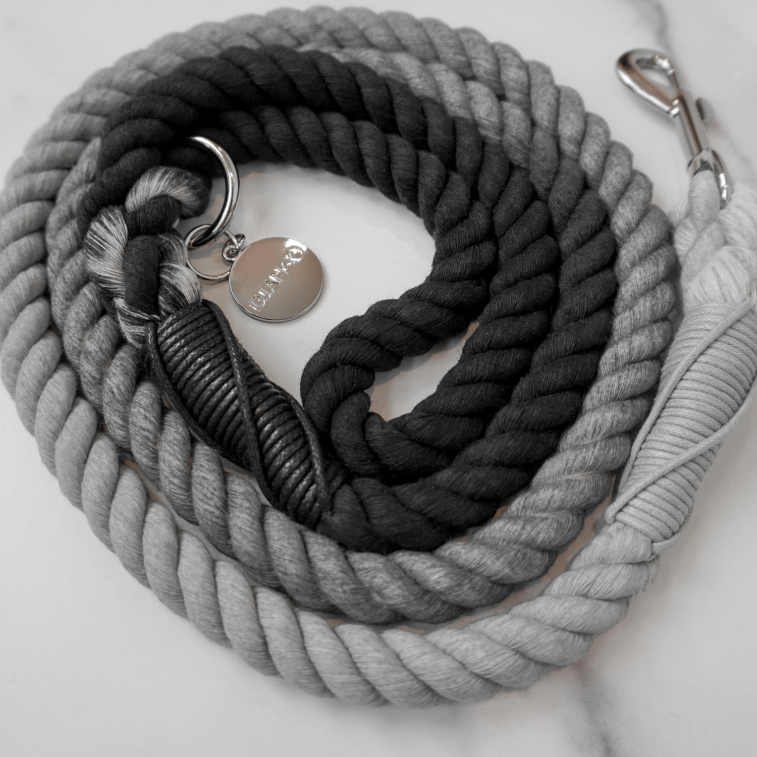 A modern, sophisticated dog leash with a gray ombre design. Handmade, strong, and comfortable for both dogs and owners.