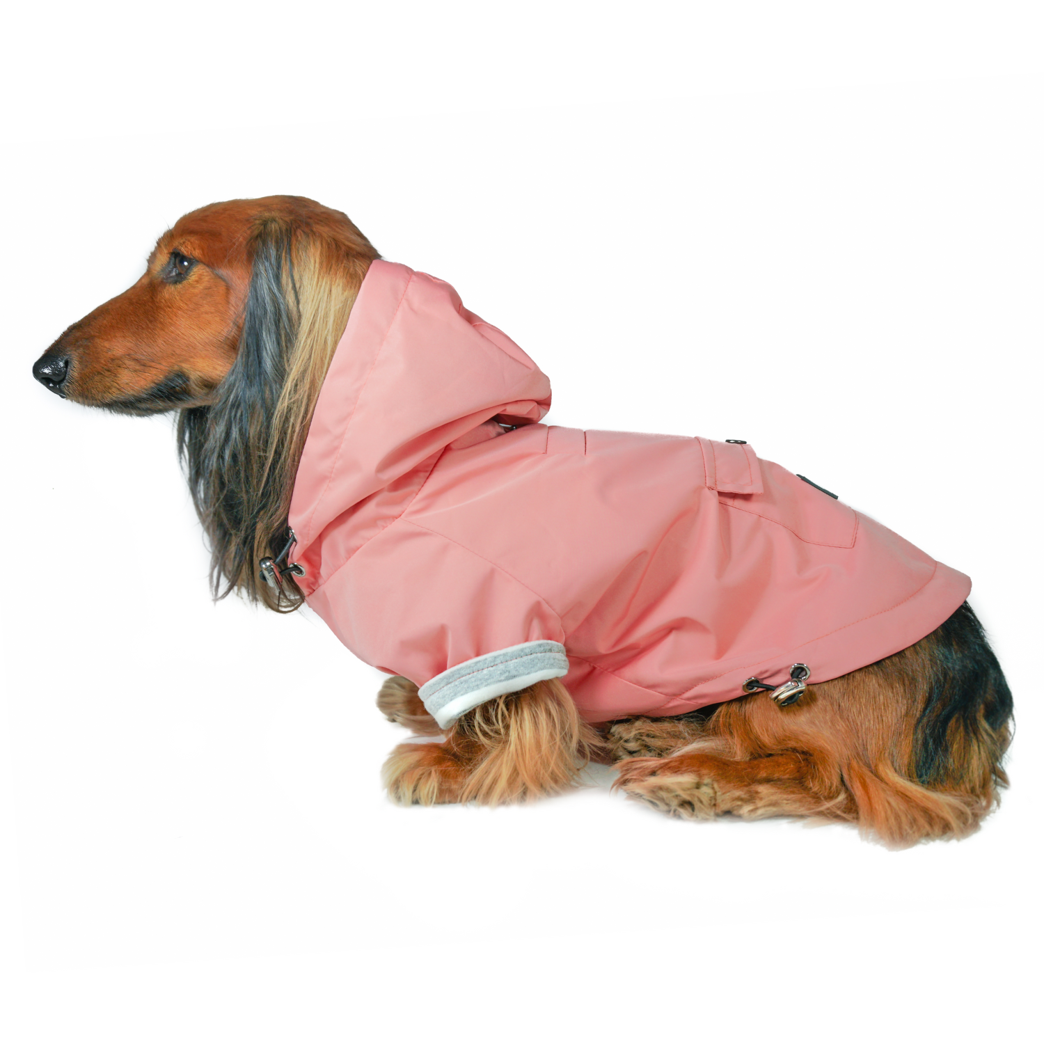 Premium Pink Dog Raincoat: DJANGO's Highland Dog Jacket and Raincoat is a stylish pink raincoat designed to keep dachshunds and small to medium-sized dogs dry and comfortable in wet weather.