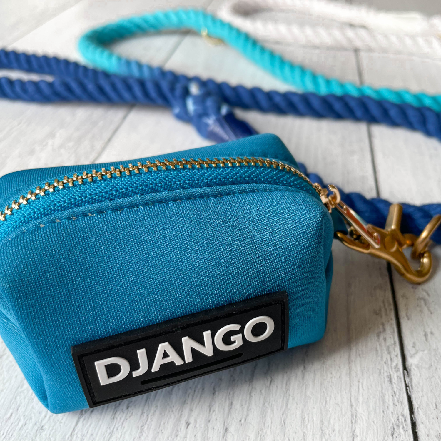 Vibrant Pacific Blue Dog Poop Bag Carrier – DJANGO’s stylish and functional walk-time essential.