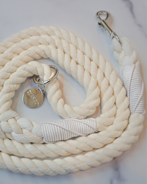 DJANGO Ivory Cotton Rope Dog Leash - You and your dog will be the most stylish ones on the sidewalk with this handcrafted and hand-dyed green ombré cotton rope leash. Crafted from soft and flexible three-strand natural cotton rope, the rope leashes are hand-spliced and the ends whipped, resulting in an incredibly strong yet effortlessly chic and comfortable dog lead. Silver hardware adds additional sophistication to the stylish dog lead. Leash length measures 5 feet (152 cm) - djangobrand.com