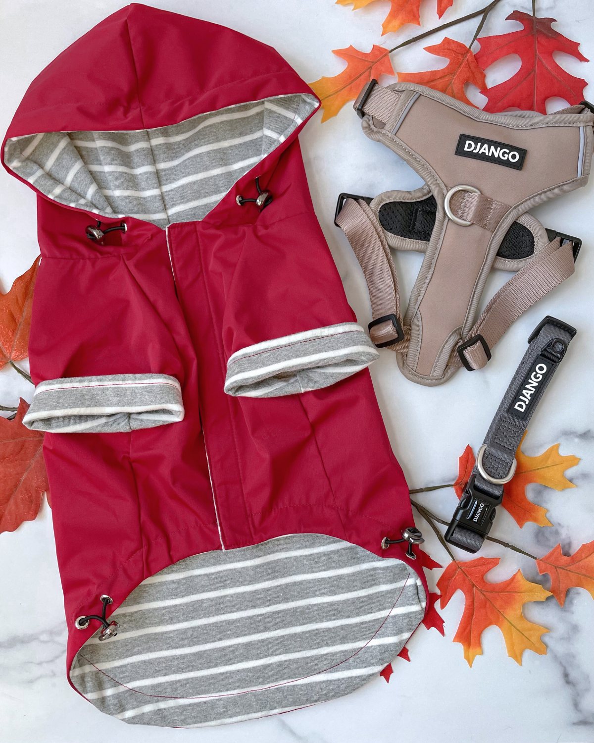 Features of this waterproof dog jacket and hooded raincoat for dogs include a water-repellent exterior, cozy interior lining, adjustable hood and hem, back pocket, and no-leak harness-to-leash portal