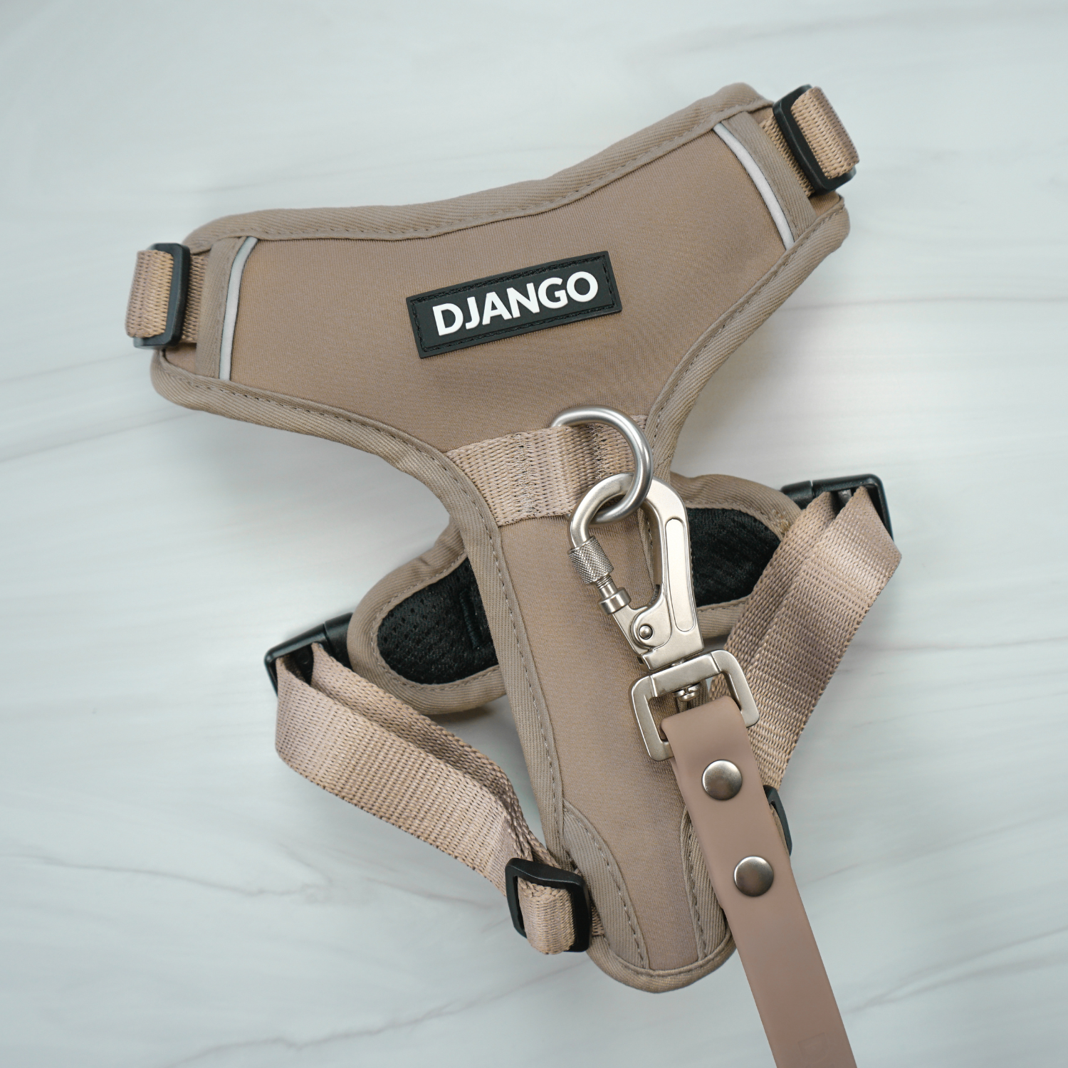 DJANGO Tahoe No Pull Dog Harness - Key features include a weather-resistant and padded neoprene exterior, a narrow and deep harness body (to prevent the risk of chafing) reflective piping, and soft webbing. Maisey is a miniature poodle and bichon mix and wears size small in all DJANGO dog harnesses. - djangobrand.com