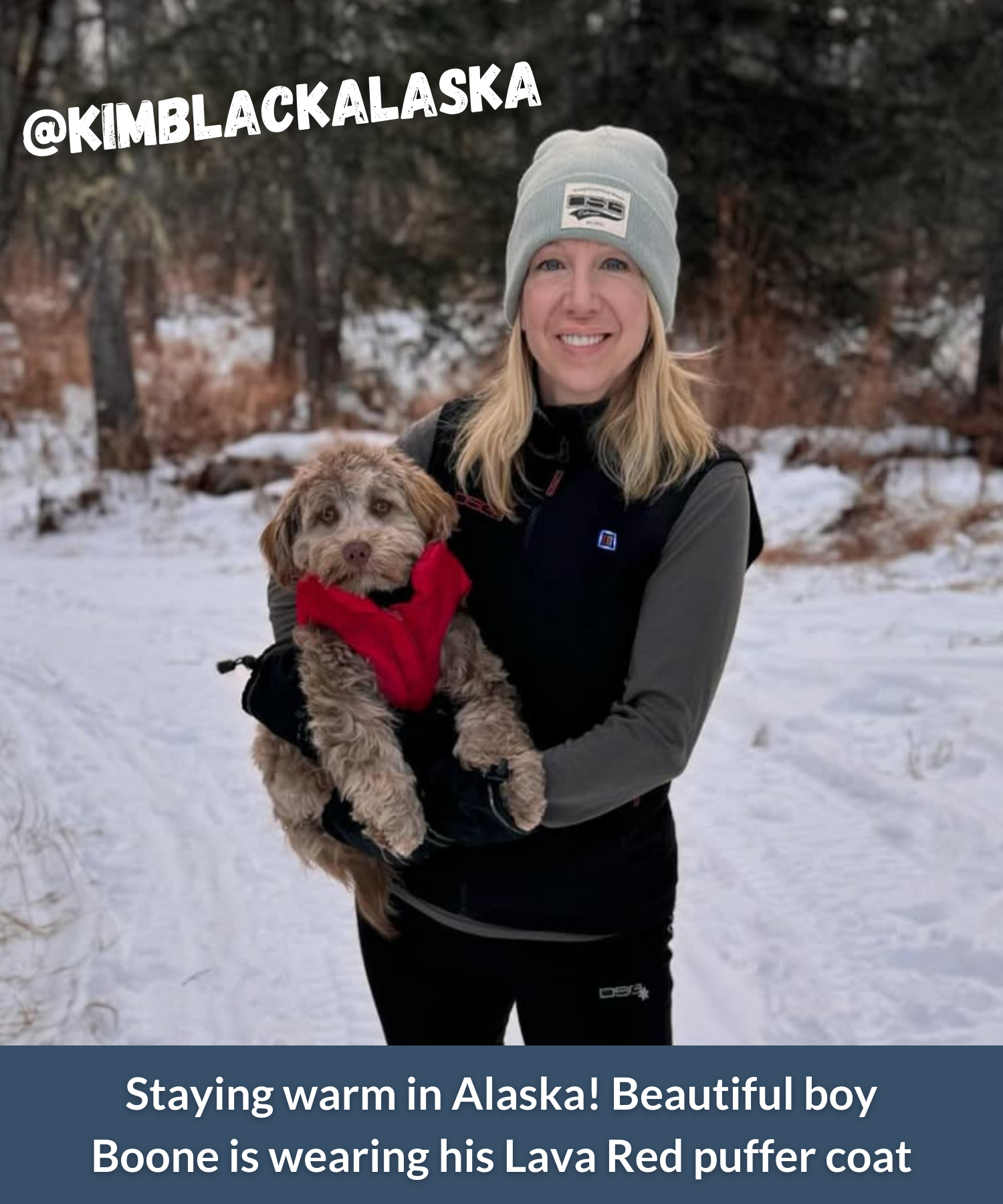 Dog mom holding adorable puppy in red puffer dog coat outside with snow