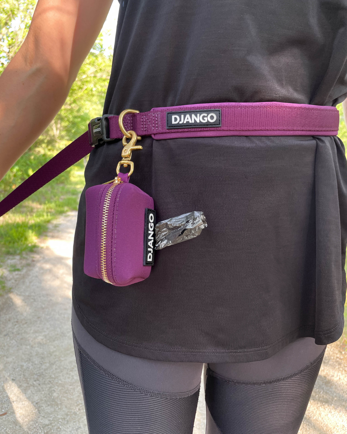 Use your DJANGO hands-free leash for around-the-waist wear and hands-free functionality. Attach your favorite waste bag holder to the solid cast brass D-ring - djangobrand.com
