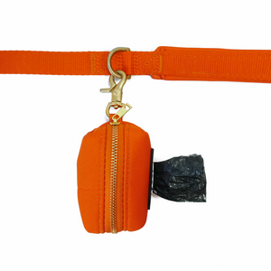 DJANGO Dog Waste Bag Holder - Chic and classy poop bag holder for dogs - Sunset Orange neoprene with solid brass hardware - djangobrand.com