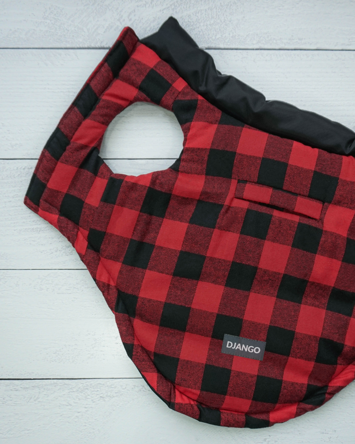DJANGO's Reversible Puffer features a super cozy red and black checkered 'buffalo plaid' interior lining that can be worn facing outwards. Dog and their hoomans love the oversized armholes, adjustable hem, and spacious and easy-access leash portal - djangobrand.com